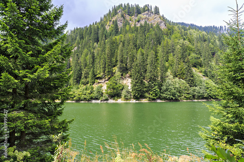 Landscape with Petrimanu Lake in Romanian mountains photo