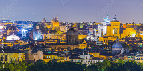 night view over rome taken from the top of gianicolo hill. the most interesting monument on the horizon is snow white vittoriano building with distinct statue on top. photo