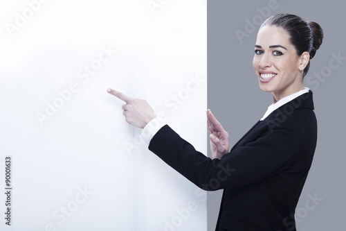 Woman pointing at a blank board