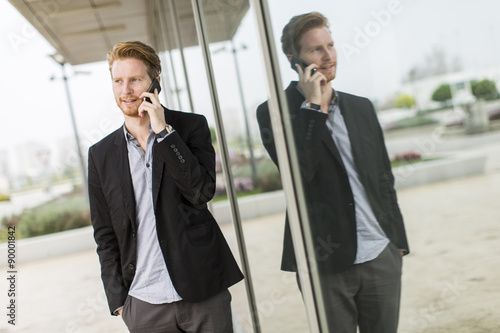 Young man on the street with mobile phone