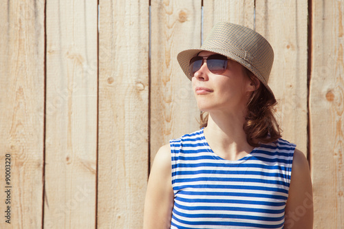 Girl in a hat and sunglasses.