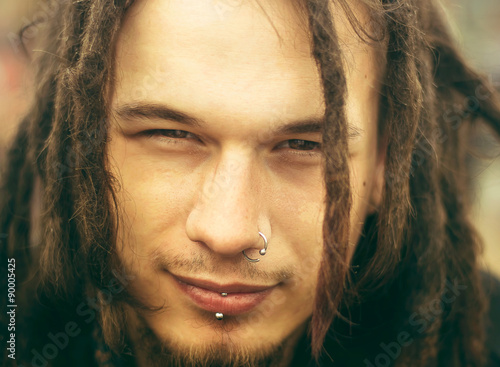 Valokuva Portrait of a young man with dreadlocks