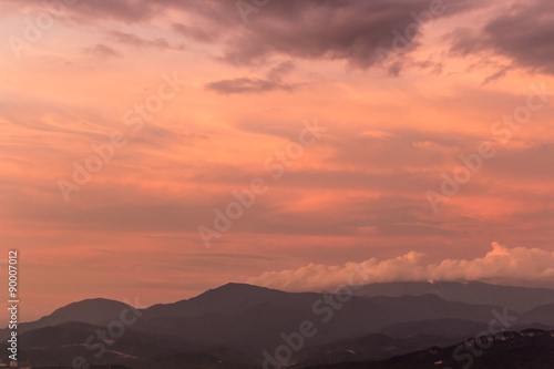dramatic purple sky over misty hills © zgurski1980