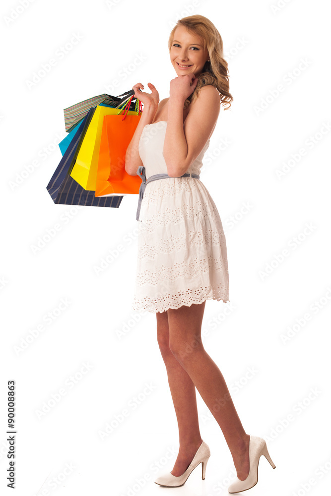 Beautiful young blonde caucasian woman holding vibrant shopping Beautiful young blonde caucasian woman holding vibrant shopping