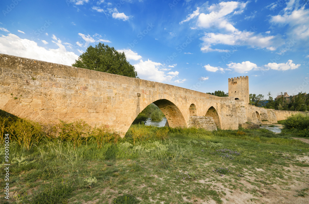 Scenic view of an ancient stone medieval bridge at dusk in Frias, Castilla y Leon, Spain.