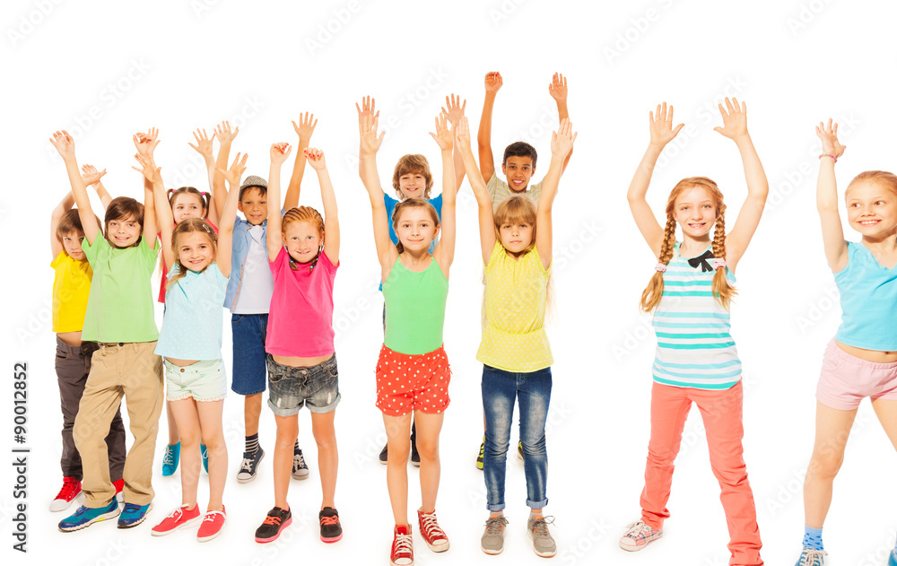 Kids stand together boys and girls rise hands 