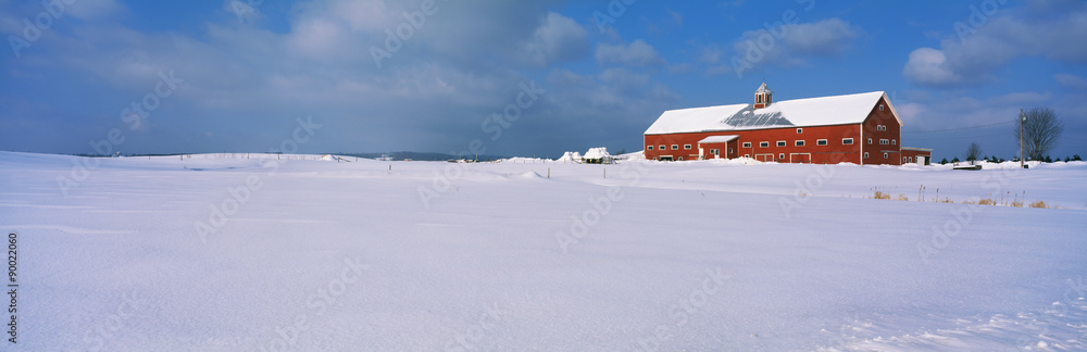 This is a red barn in the snow on Darling Hill Road. It is representative of winter in New England.