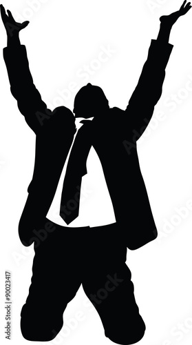 Silhouette of a businessman in a suit on his knees and begging with raised arms.