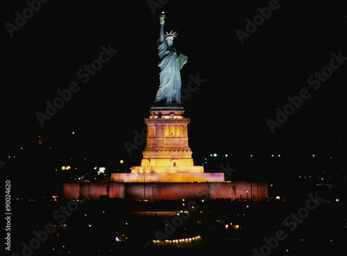 This is the Statue of Liberty lit up at night on Liberty Weekend. It was taken from the Aircraft Carrier Kennedy.