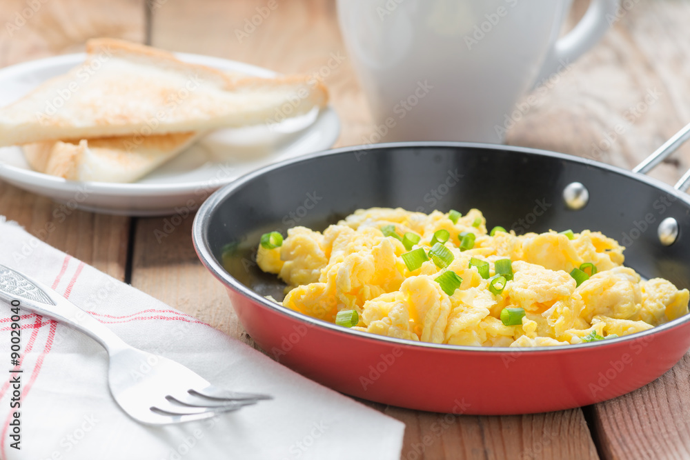 Scrambled egg with bread and coffee. Scrambled egg with bread and coffee.