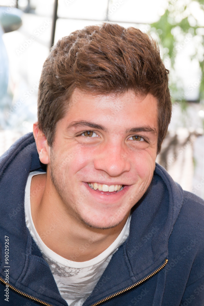Portait of a young man, teenager smiling Portait of a young man, teenager smiling