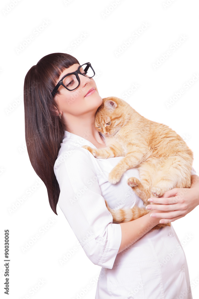 Portrait of a beautiful woman holding red cat
