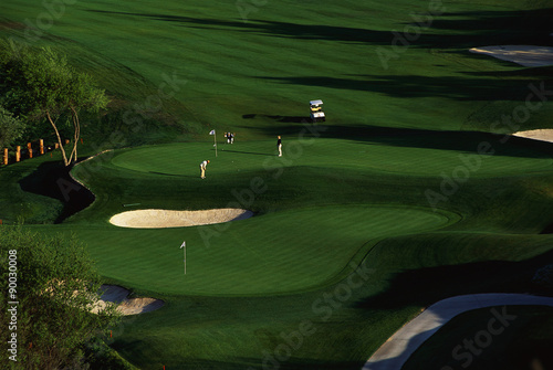 These are golfers approaching the green at Carmel Valley Ranch Golf Course, designed by Pete Dye, in Carmel, California.