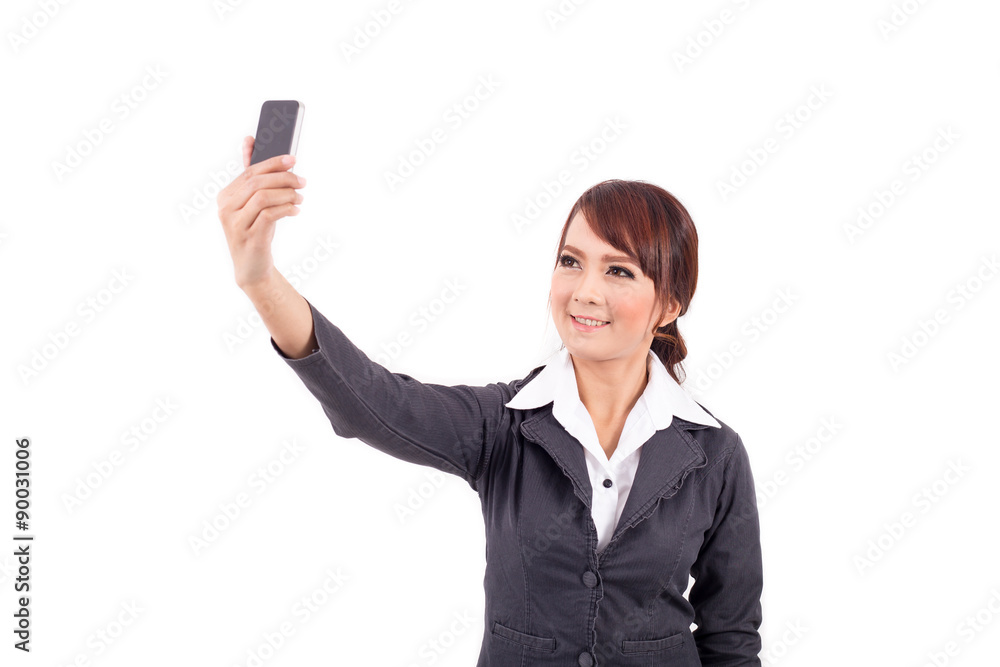 Young business woman holding and look at smartphone on white background Young business woman holding and look at smartphone on white background