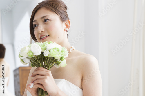 Beautiful bride has a wedding bouquet