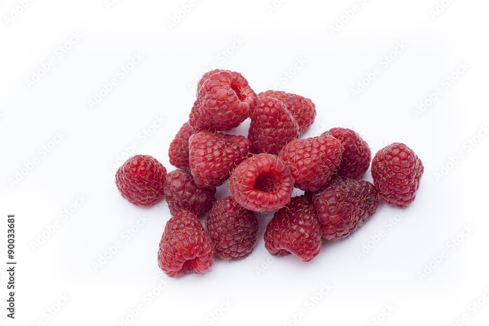 Fresh sweet red raspberry with leaves isolated on white Fresh sweet red raspberry with leaves isolated on white