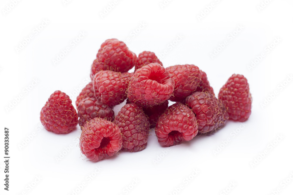 Fresh sweet red raspberry with leaves isolated on white Fresh sweet red raspberry with leaves isolated on white