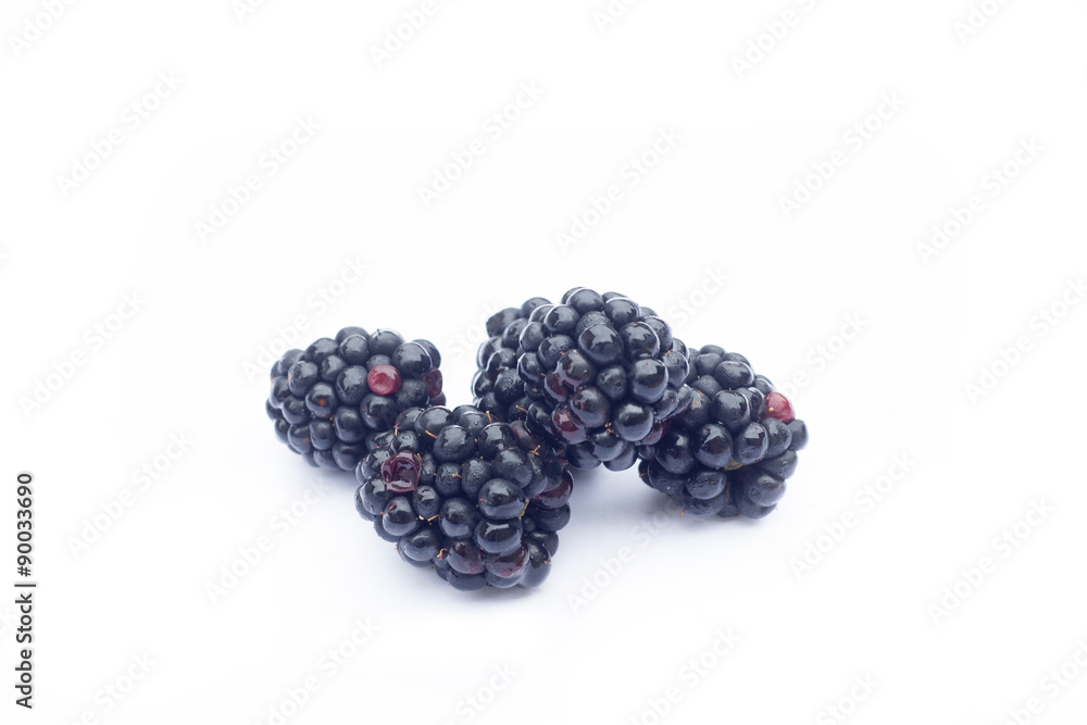 Fresh sweet blackberries with leaves isolated on white, selective focus Fresh sweet blackberries with leaves isolated on white, selective focus