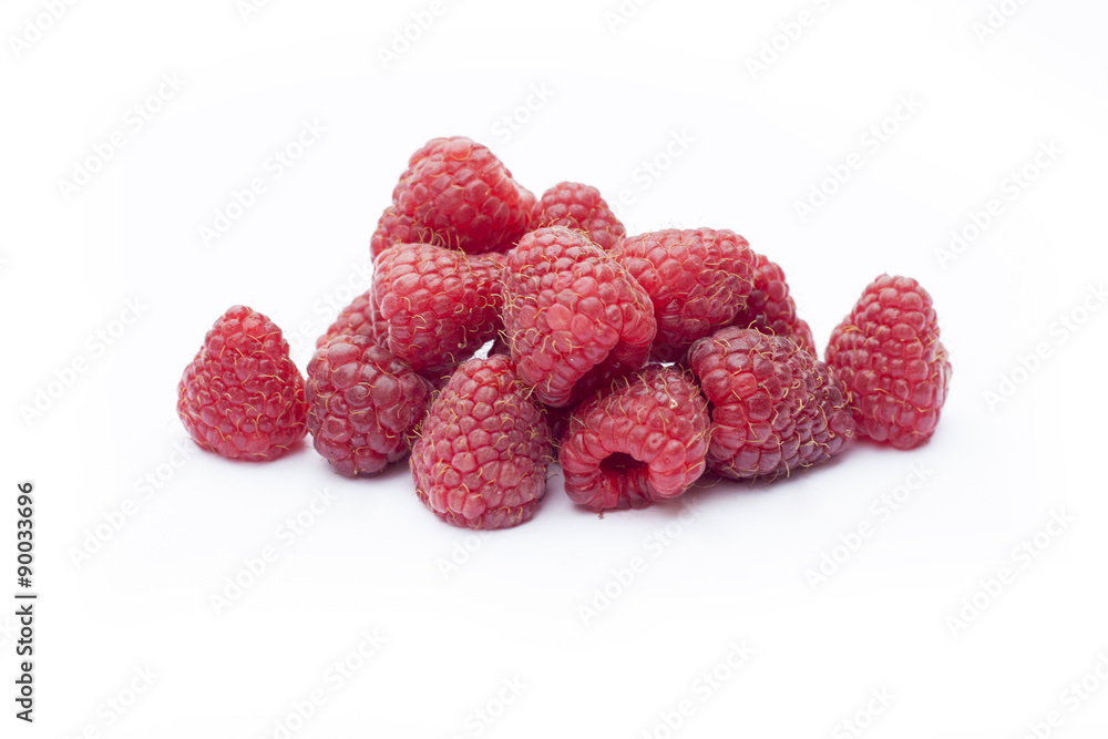 Fresh sweet red raspberry with leaves isolated on white Fresh sweet red raspberry with leaves isolated on white