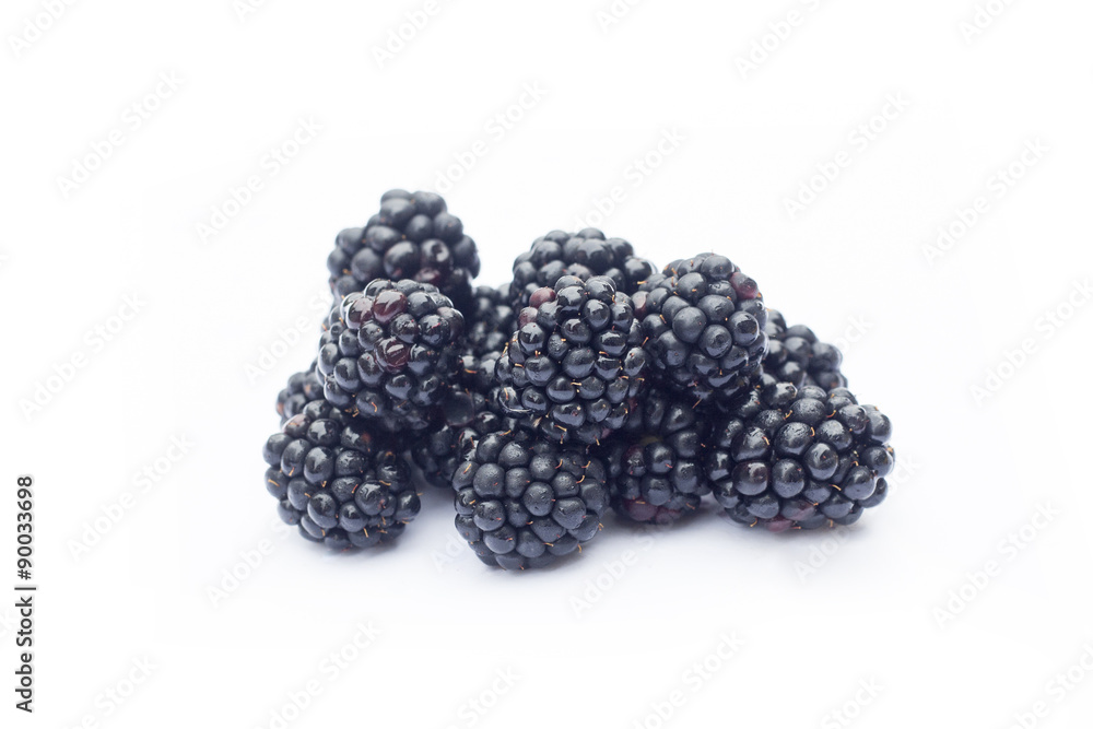Fresh sweet blackberries with leaves isolated on white, selective focus Fresh sweet blackberries with leaves isolated on white, selective focus