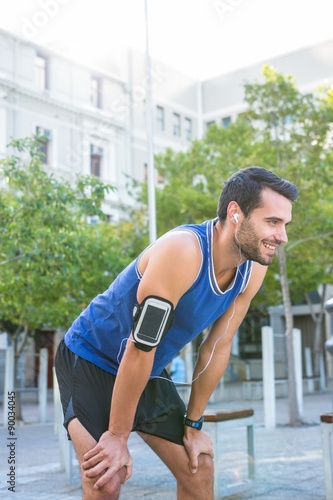 Smiling handsome athlete prepare to exercise