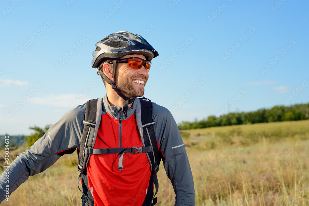 Portrait of Young Cyclist in Helmet and Glasses Portrait of Young Cyclist in Helmet and Glasses
