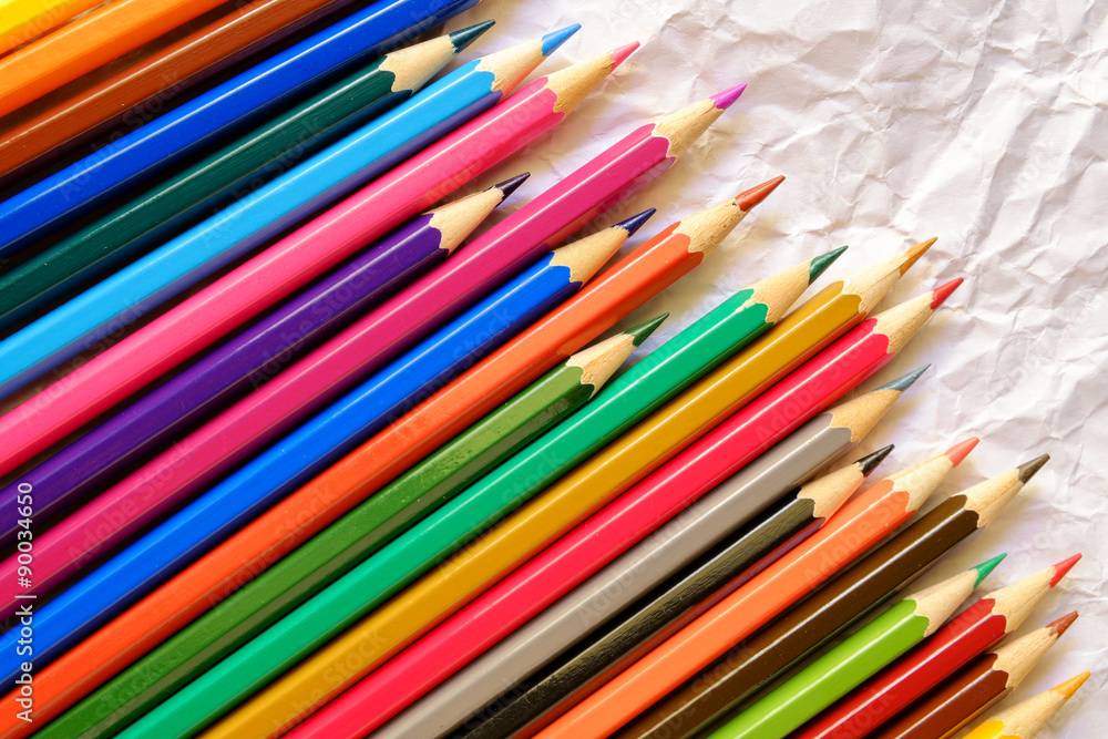 Color pencils on Crumpled white paper background Color pencils on Crumpled white paper background