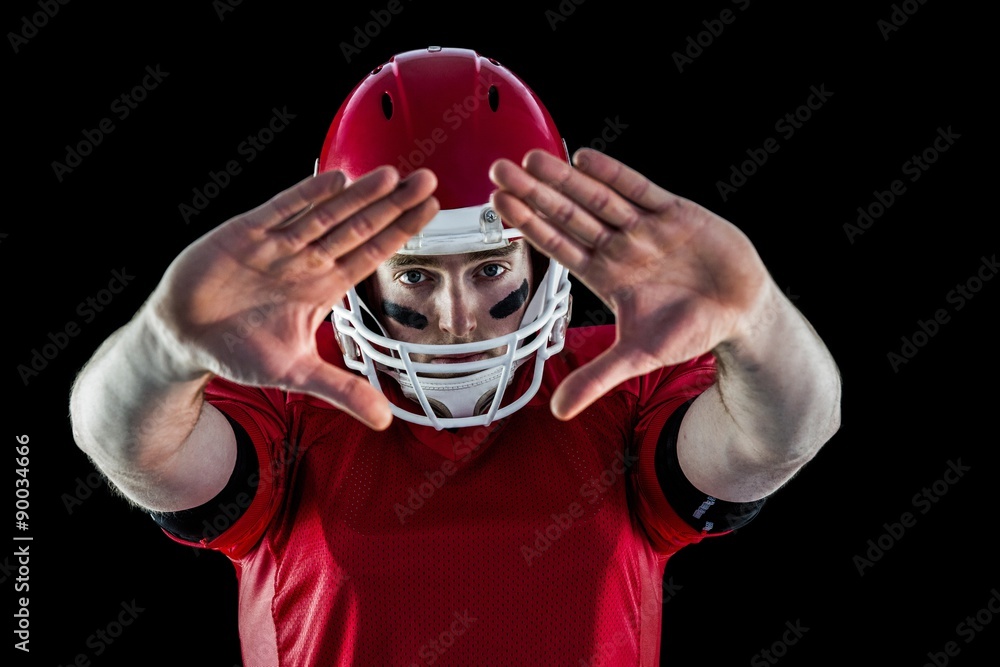 Portrait of american football player protecting himself Portrait of american football player protecting himself