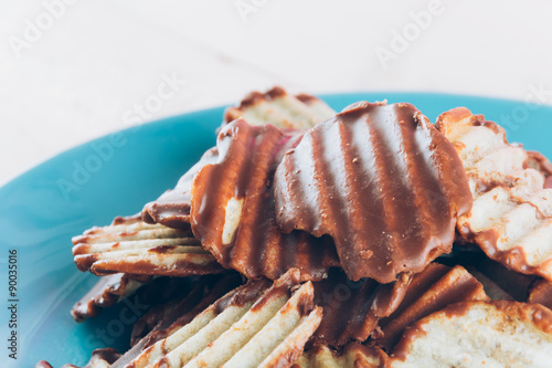 potato chip with chocolate on wood