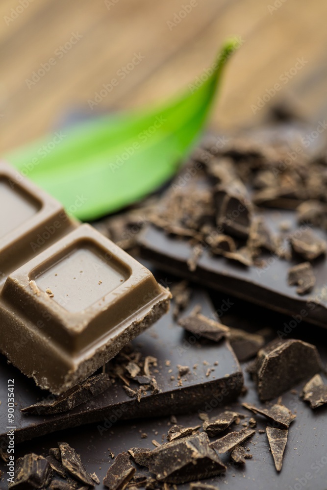 Chocolate with mint on a wooden table Chocolate with mint on a wooden table
