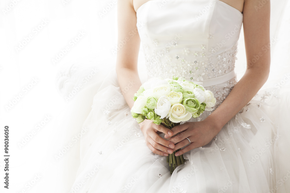 Bride sitting with a bouquet in the waiting room Stock Photo | Adobe Stock