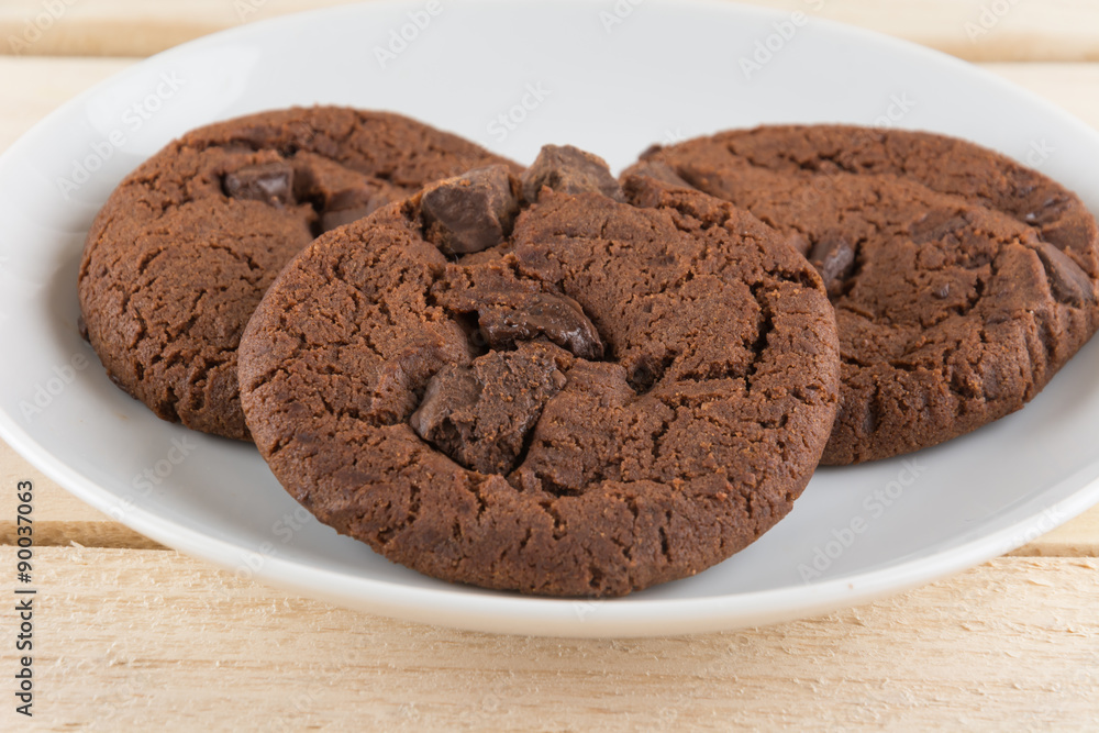 soft dark chocolate brownie cookies on wood soft dark chocolate brownie cookies on wood