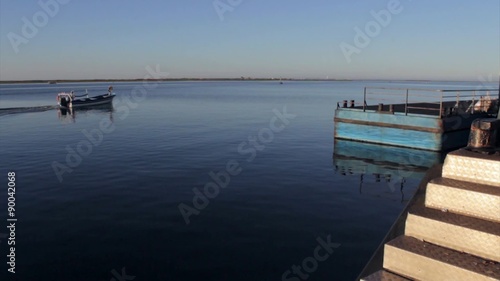 Boat pier seascape view, in Olhao, Ria Formosa wetlands park
