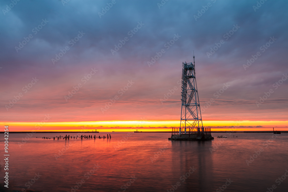 Lighthouse at dramatic Baltic sunset