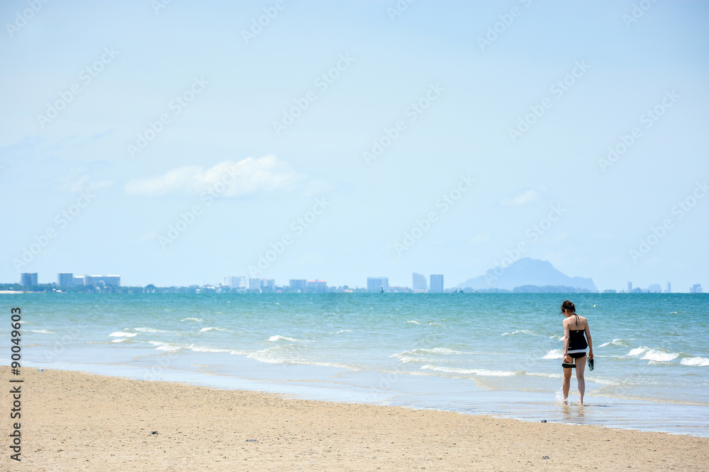 woman walk on the beach woman walk on the beach