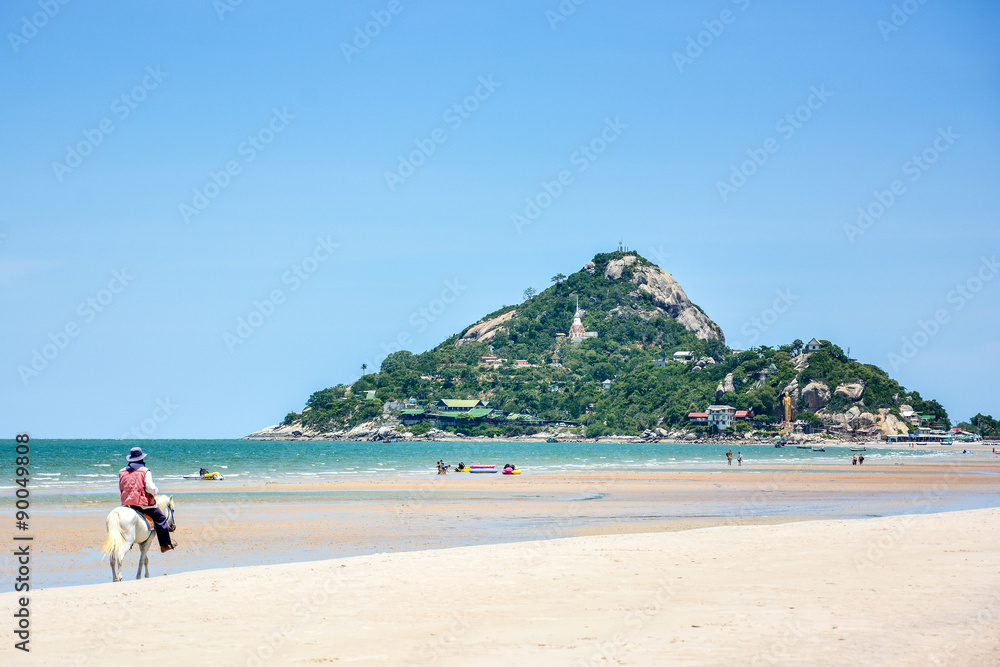 man ride the horse on the beach