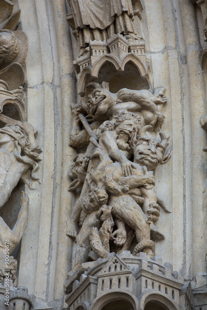 Paris - West facade of Notre Dame Cathedral. Archivolts of The Last Judgment portal