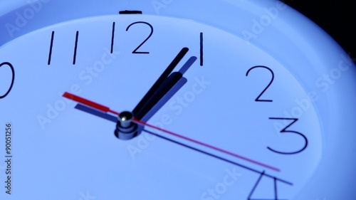 business clock closeup on white background 