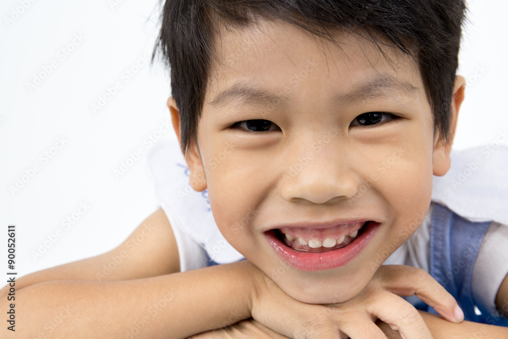 Little asian boy with smile face on gray background Little asian boy with smile face on gray background