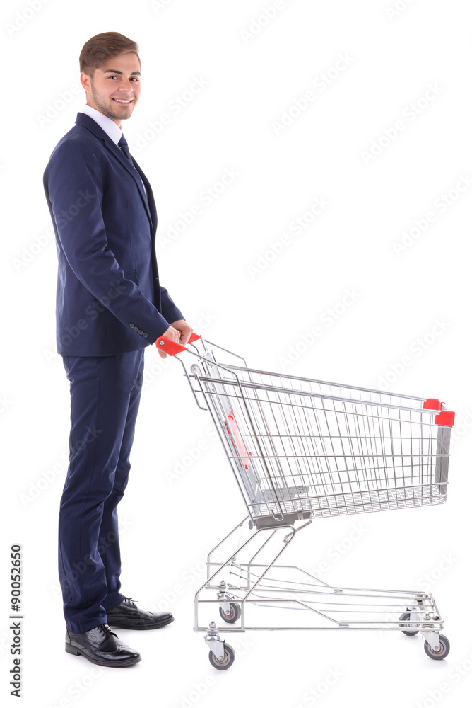 Young man with empty shopping cart, isolated on white Young man with empty shopping cart, isolated on white
