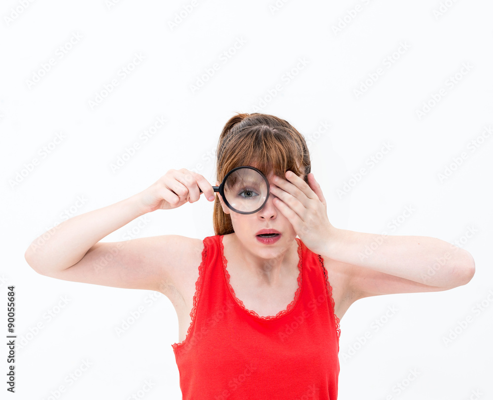 woman with magnifying glass on a white background woman with magnifying glass on a white background