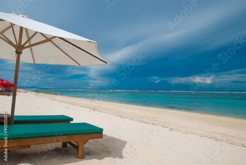Deckchair on the beach called pandawa Bali in Indonesia.