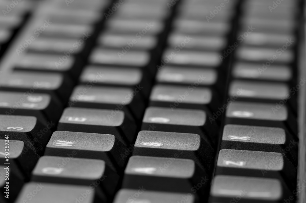 Computer keyboard. Close up of mostly blurred bands of keys. Computer keyboard. Close up of mostly blurred bands of keys.