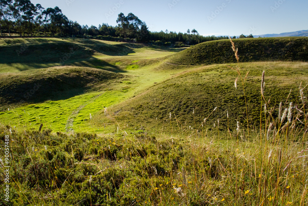 Ruins of Cochasqui pyramids, archaeological site, with Cotopaxi in the background, Ecuador Ruins of Cochasqui pyramids, archaeological site, with Cotopaxi in the background, Ecuador