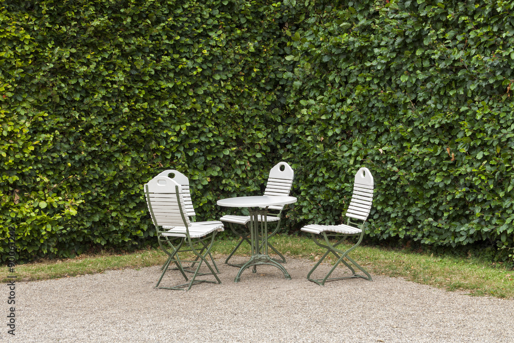White table and chairs in garden