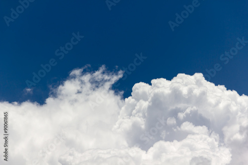 beautiful big puffy white clouds in light cheerful light blue sky with fresh feeling