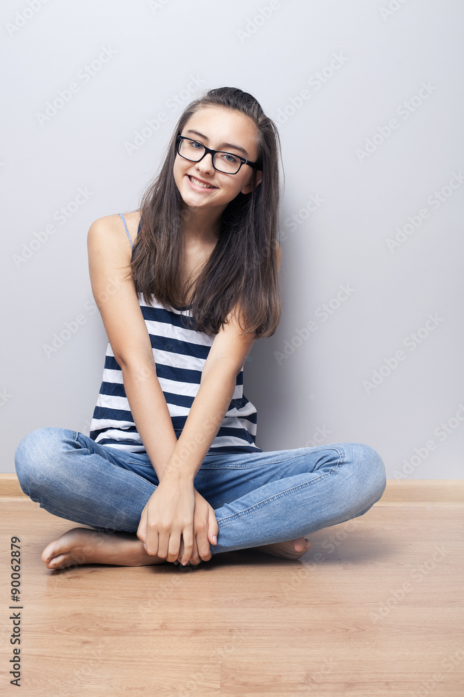 Teenage girl smiling, looking at camera. Teenage girl smiling, looking at camera.