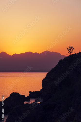 Sunrise over the mountains and the sea photo