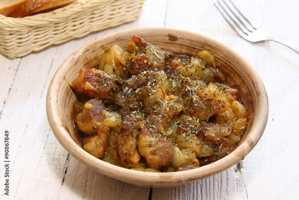 Fototapeta premium Braising meat with Italian herbs