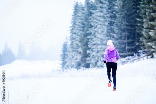 Woman running in winter, fitness inspiration and motivation